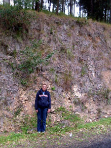 Alana Garnett stands at embankment base