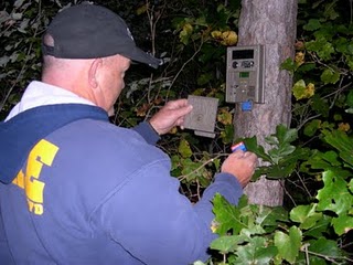 Randy Harrington checks camera traps in the Kiamichi National Forest of SE Oklahoma